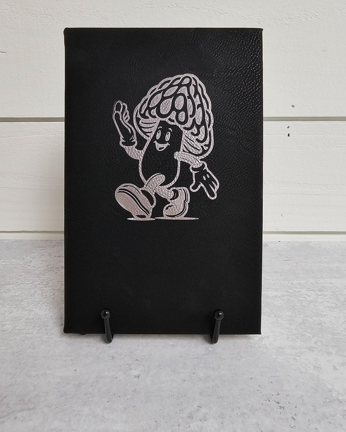 Personalized journal in black with silver engraved with fun cartoon mushroom guy design.