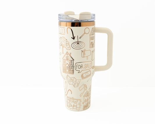 Tumbler with real estate-themed design on a white background