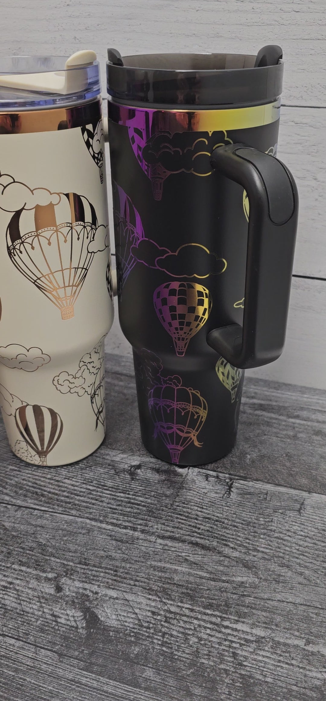 Laser engraved 40oz stainless steel tumblers with hot air balloon and cloud design